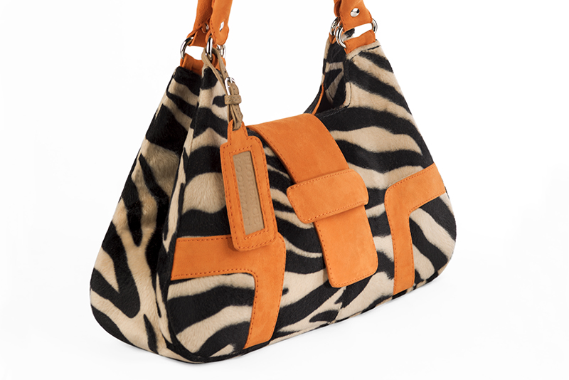 Handcrafted women's luxurious elegant handbag in animal print and apricot orange. Perfect for elevated everyday style.   
                Choose from our luxurious collections of leather and fabric to perfectly match your handbags to your outfits.